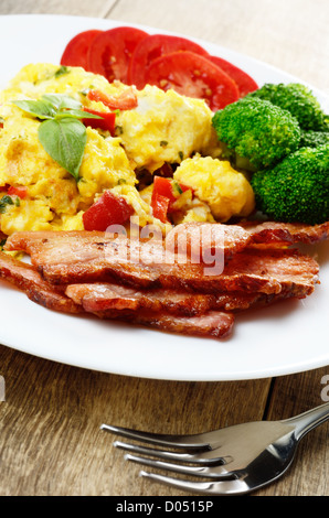 Omelette with fried bacon on the white plate Stock Photo