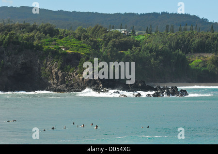 Surfers waiting on the next wave at Honolua Bay Maui Hawaii Stock Photo