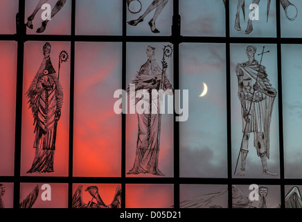 Evening sunset with a new crescent moon seen through the West Screen at Coventry Cathedral, West Midlands, UK. Stock Photo