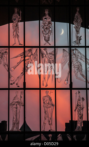 Evening sunset with a new crescent moon seen through the West Screen at Coventry Cathedral, West Midlands, UK. Stock Photo