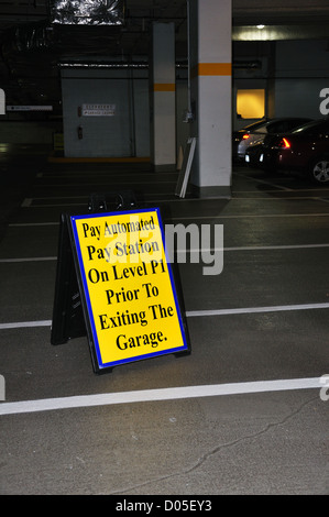 Automated payment sign in a parking garage Stock Photo