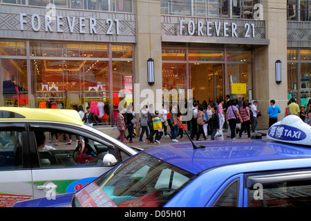 Shanghai China,Chinese Huangpu District,East Nanjing Road,National Day Golden Week,Asian street scene,hanzi,taxi,taxis,cab,cabs,shopping shopper shopp Stock Photo