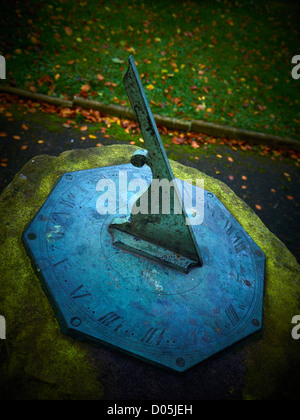 Old weathered sun dial Stock Photo