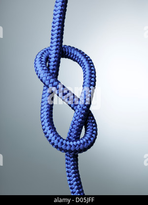 Blue rope with figure of eight stopper knot. Stock Photo