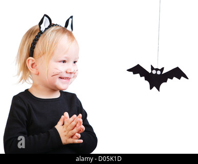 Toddler girl in black cat costume Stock Photo