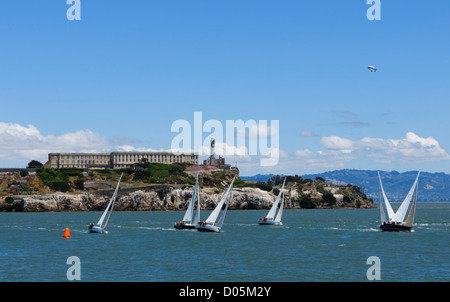 San Francisco - Summer Sailstice yachting (June 23rd 2012). J-105 class racing yachts in the Small Boat Race, with Alcatraz. Stock Photo