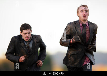 Cholmondeley, UK. 17th November 2012.  Challengers approach the finish line during the North-West round of Tough Mudder UK at Cholmondeley Estates. Thousands of participants run the 10 to 12 mile obstacle course which involves water, freezing temperatures and fire, to test toughness, fitness, strength, stamina and mental grit. Alamy Live News. Stock Photo