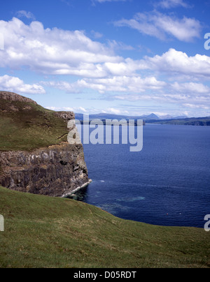 Cliffs and headland near Idrigill Point Loch Bracadale Orbost Duirinish Red Cuillin in the far distance Isle of Skye Scotland Stock Photo