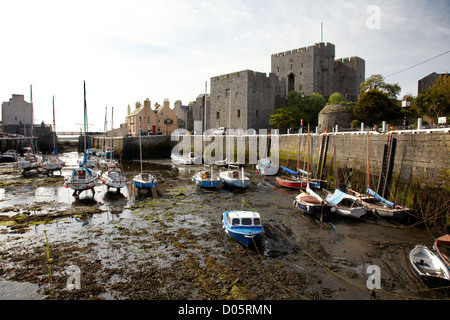Castle Rushen and Castletown harbour at low tide Stock Photo