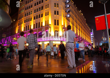 Shanghai China,Huangpu District,East Nanjing Road,pedestrian mall,National Day Golden Week,night evening,Asian man men male adult adults,shopping shop Stock Photo