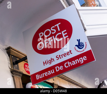 Post Office sign advertising Bureau De Change currency exchange service and UK national lottery tickets Stock Photo