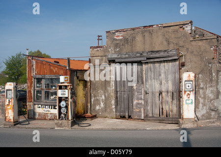 Derelict old garage / petrol / gas station Llanrug Gwynedd North Wales UK Stock Photo