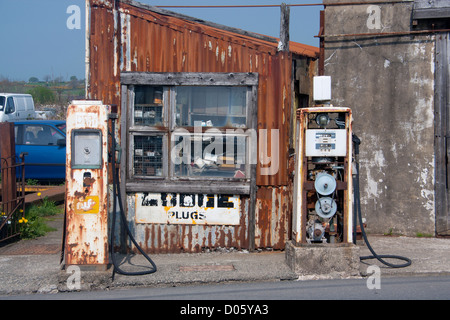 Derelict old garage / petrol / gas station Llanrug Gwynedd North Wales UK Stock Photo