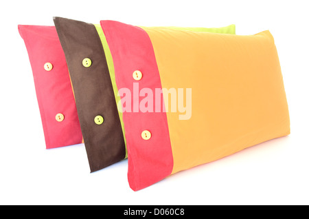 three colored pillows with buttons isolated on white Stock Photo