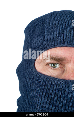 A burglar wearing a blue ski mask to hide his identity. Isolated on white for user convenience. Stock Photo