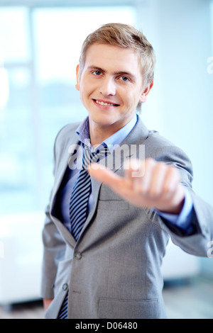 Portrait of cheerful businessman looking at camera while pointing at you Stock Photo