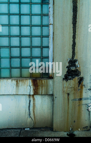 Cracked Concrete wall with glass bricks Stock Photo