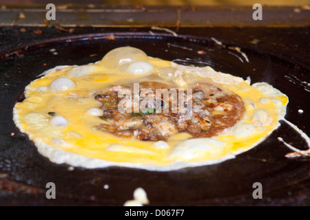 Fried egg with oysters in Chinese style Stock Photo