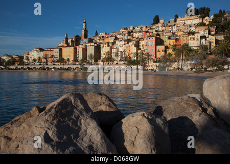 COLOURFUL HOUSES OLD TOWN IN FRONT SABLETTES BEACH SAINT-MICHEL ARCHANGE BASILICA MENTON ALPES-MARITIMES (06) FRANCE Stock Photo