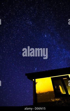 Stars in the Night Sky over a house viewed from Northern Europe. Stock Photo