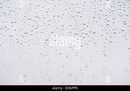 Raindrops on window glass blurred abstract Stock Photo