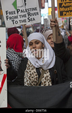 Simultaneous Demonstrations from pro-Palestinian & pro-Israeli groups  in Times Square, NYC, concerning the present attacks from both sides. Pro-Palestinian demonstrators Stock Photo