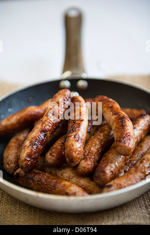 Frying pan full of sausages. Stock Photo