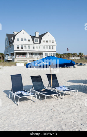 Beach umbrellas line the waterfront at Elizabeth Pointe Lodge resort hotel at Amelia Island, Florida Stock Photo