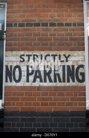 strictly no parking notice stencilled onto a brick wall in southwark, london, england Stock Photo