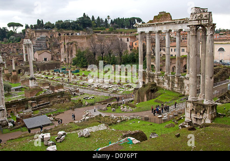 view over ruins: temple of Saturn in Roman Forum, Romanum, in Italy Stock Photo