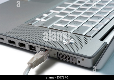 A laptop with an internet wire Stock Photo