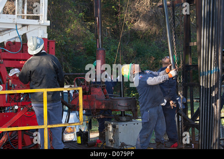 Longview, Texas - Workers on an oil drilling rig. Stock Photo