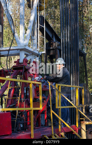 Longview, Texas - Workers on an oil drilling rig. Stock Photo