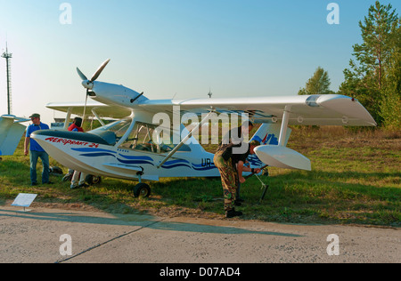 Light multipurpose amphibian - left side view. Plane fastening to the earth on parking. Stock Photo