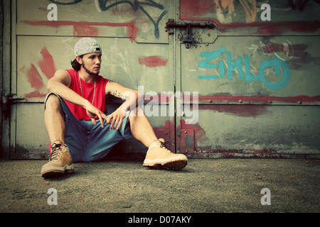 Young man sitting and thinking Stock Photo