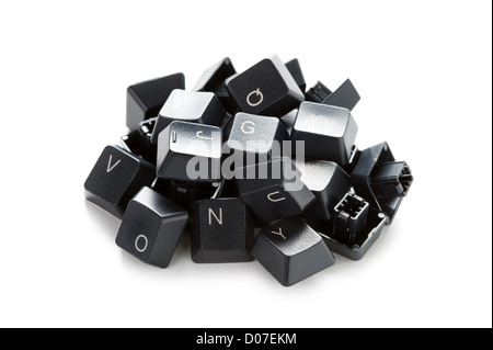 a pile of obsolete, useless, broken computer keyboard keys isolated on a white background Stock Photo