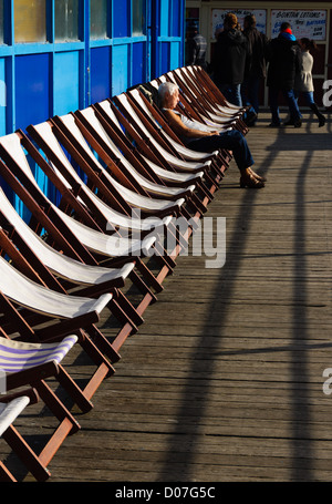 Blackpool, Lancashire, UK's top amusement and fun seaside resort - deckchair on central pier. Stock Photo