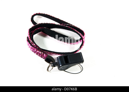 Black Whistle have pink neck strap on white background. Stock Photo