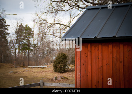 red barn with black roof Stock Photo - Alamy