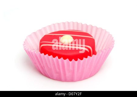 delicious pink petit four over white background Stock Photo