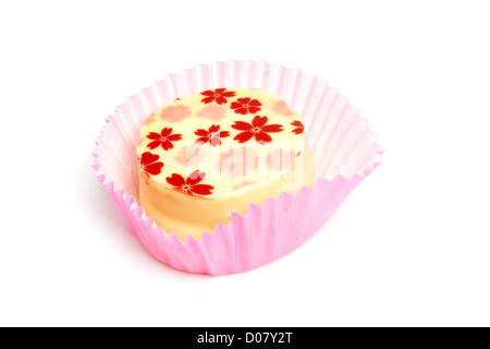 Delicious petit four, little cake over white background Stock Photo