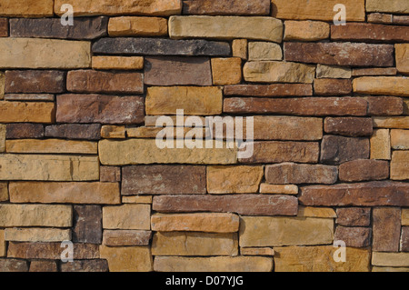 Wall of Multi Colored Stone used as a background Stock Photo