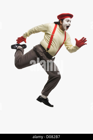 Mime in a running pose Stock Photo