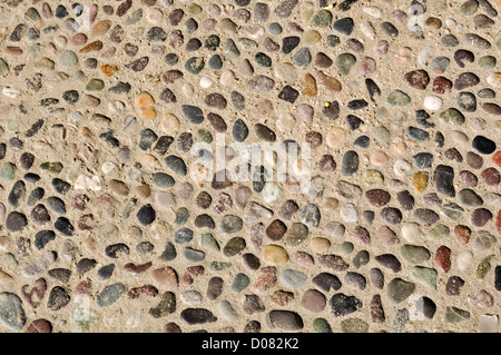 Colorful Rocks and Stones in Sand Background Stock Photo