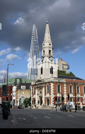 The Shard looms up behind the Church of St George the Martyr, Borough High Street, London SE1. Stock Photo