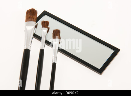Mirror and brush set for touch-ups Stock Photo