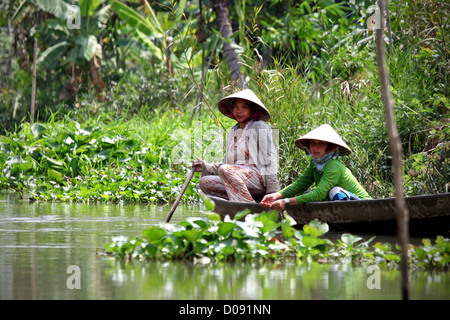 WOMEN LIVING ALONG THE LITTLE CANALS OF THE MEKONG DELTA VIETNAM ASIA Stock Photo