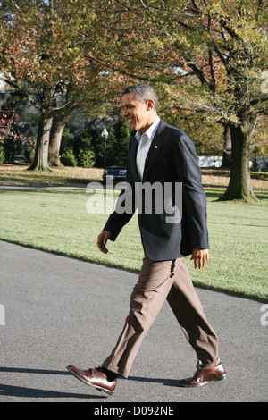 President Barack Obama arrives at the White House after attending a ...