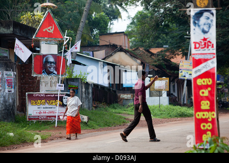 PROPAGANDA POSTER FROM THE KERALA COMMUNIST PARTY ON A STREET IN NEDUNGOLAM KERALA SOUTHERN INDIA ASIA Stock Photo