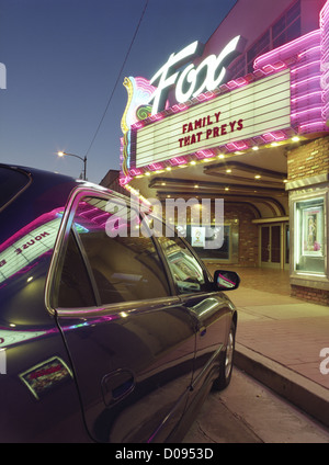 Night view of Fox Theatre, Taft, California, with neon reflected in car. Stock Photo